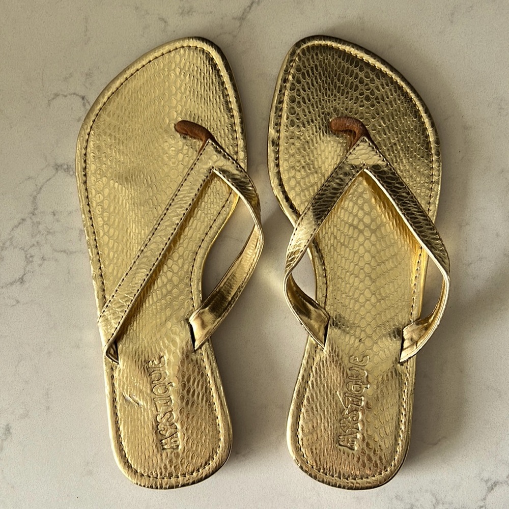 Mystique gold metallic leather sandals.